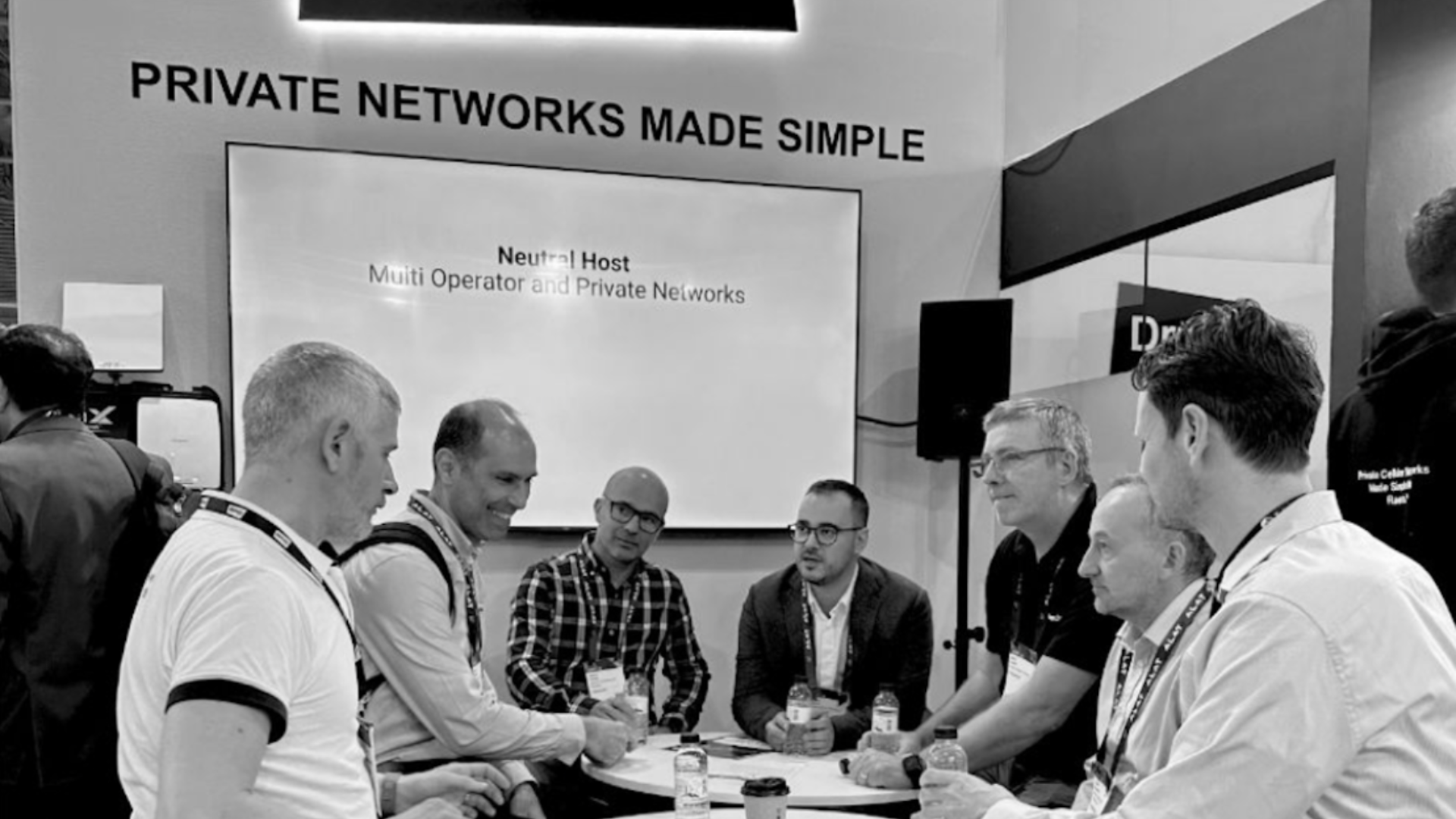 Telecom26 team meeting partners at MWC Barcelona 2026 discussing enterprise eSIM and IoT connectivity