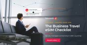 Business traveller using a secure business travel eSIM on a smartphone in an airport lounge
